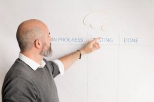 bearded-man-presenting-business-plan_23-2148513882-1