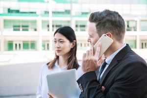 business-couple-make-phone-call_23-2147707517