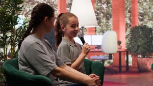 cheerful-teenager-urged-sing-microphone-counseling-session_482257-107568