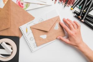close-up-hand-with-envelope_23-2148577742