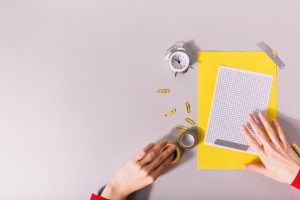 hands-creating-composition-yellow-paper-bright-clips_197531-12531