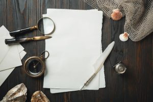 old-fashioned-flat-lay-with-letters-writing-accessories-dark-wooden-table_155003-3586-1