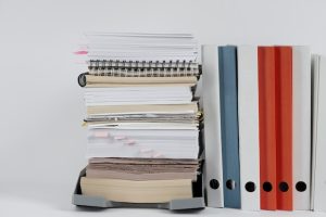 still-life-stacks-papers-documents_23-2151118397