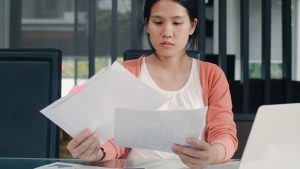 young-asian-pregnant-woman-records-income-expenses-home-mom-girl-happy-using-laptop-record-budget-tax-financial-document-e-commerce-working-living-room-home_7861-2186