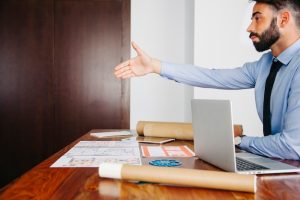 businessman-stretching-out-hand_23-2147653316