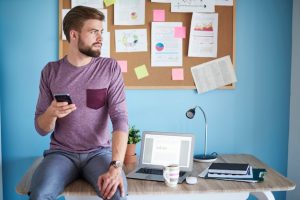 busy-man-using-some-mobile-devices_329181-14530