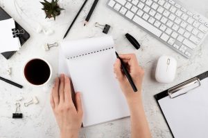 close-up-hand-holding-pen_23-2148975845