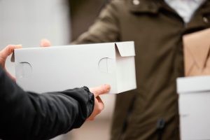 close-up-signing-package-delivery_23-2148869414