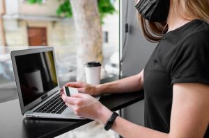 close-up-woman-ready-purchase-online_23-2148577080