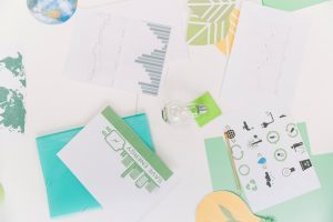 elevated-view-graph-with-natural-resources-icon-desk_23-2147826559
