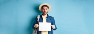 excited-tourist-straw-hat-holding-empty-piece-paper-looking-amused-going-summer-travel_1258-173884