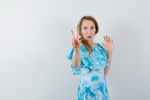 expressive-young-woman-posing-studio_176474-29025