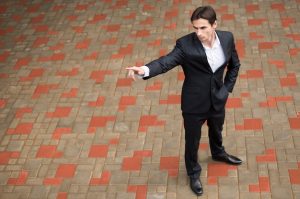 full-shot-businessman-pointing_23-2148242727
