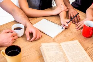 group-people-studying-together-with-coffee-wooden-desk_23-2148192548