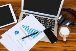 laptop-with-papers-with-graphics-top_1232-1382