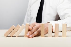 man-stopping-wooden-pieces-fall-concept_23-2148546920