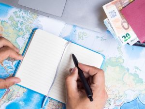 man-writing-notebook-wallet_23-2148256056