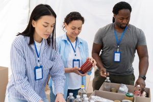 people-doing-volunteer-work-foodbank_23-2149012250