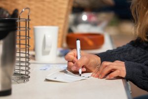 side-view-woman-garage-sale_23-2150574481
