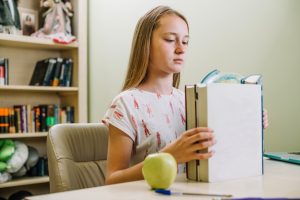 studying-girl-with-stacked-books_23-2147666637