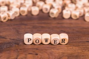 text-power-written-wooden-dices-brown-desk_23-2148101417