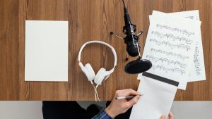 top-view-hand-holding-notebook_23-2148845400