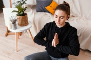 woman-meditating-indoor_23-2148835380