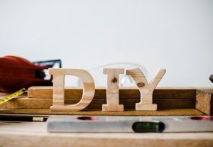 wooden-diy-sign-with-tools_53876-63290