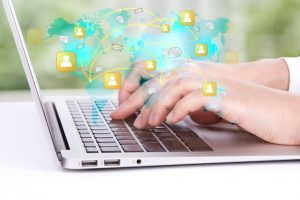 worker-watching-his-laptop-map-world_1232-1096