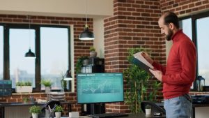 young-businessman-using-trade-market-profit-data-screen-create-financial-investment-looking-stock-charts-statistics-male-broker-analyzing-hedge-hund-trend-forex-exchange_482257-39523