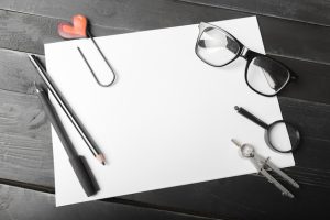 blank-notebook-pencil-with-glasses-wooden-table_93675-132181-1