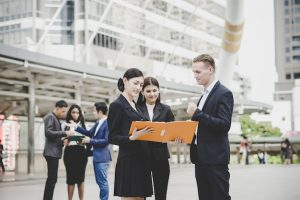 business-coworkers-discussing-new-ideas-brainstorming-together-looking-new-project-document_1150-3066