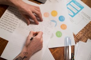 close-up-young-man-writing-virtual-classroom_23-2149200186-1