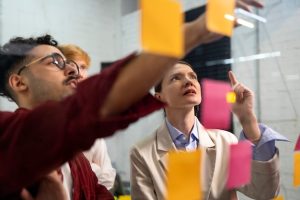 colleagues-thinking-with-post-its-side-view_23-2149362920-12