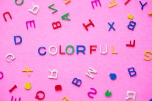 colorful-spelled-word-with-alphabets-background_53876-14678