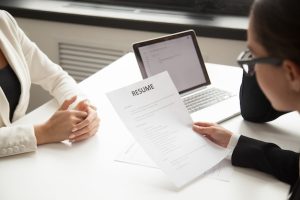 company-representatives-reading-applicant-resume-hiring_1163-4684-4