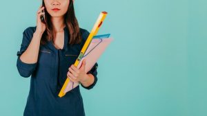 crop-asian-engineer-speaking-phone_23-2147766750