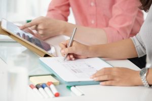 crop-modern-coworkers-with-gadget_1098-21207