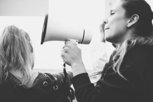 female-activist-shouting-megaphone_53876-153218-2