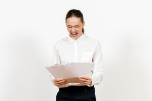 front-view-young-woman-white-blouse-holding-files-white-background-female-emotions-feeling-office-job_140725-99007-1