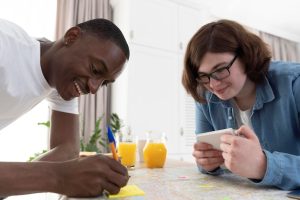 group-friends-planning-trip-while-having-breakfast_23-2148952427