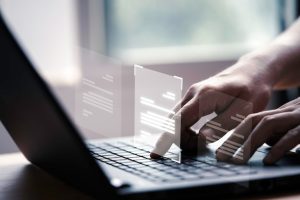 hand-using-laptop-computer-with-virtual-screen-document-online-approve-paperless-quality-assurance-erp-management-concept_616485-61-5