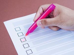 high-angle-person-checking-box-close-up_23-2148265630