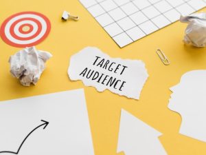 high-angle-piece-paper-with-target-audience_23-2148443790