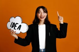 impressed-holding-idea-bubble-young-beautiful-female-wearing-black-jacket-isolated-orange-background_141793-136310-1