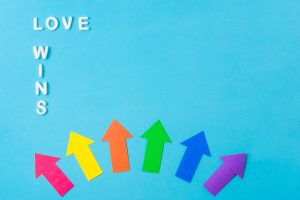 layout-paper-arrows-lgbt-colors-love-wins-words_23-2148120259