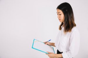 side-view-businesswoman-holding-clipboard_23-2147708538