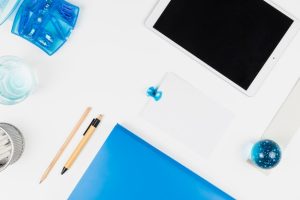 tablet-near-paper-toy-ball-pencil-pen-clips_23-2148036880-1