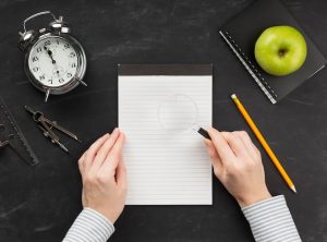 top-view-educational-elements-arrangement-with-empty-notepad_23-2148721229