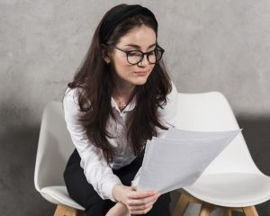 woman-reading-her-resume-before-attending-job-interview_23-2148507822-1